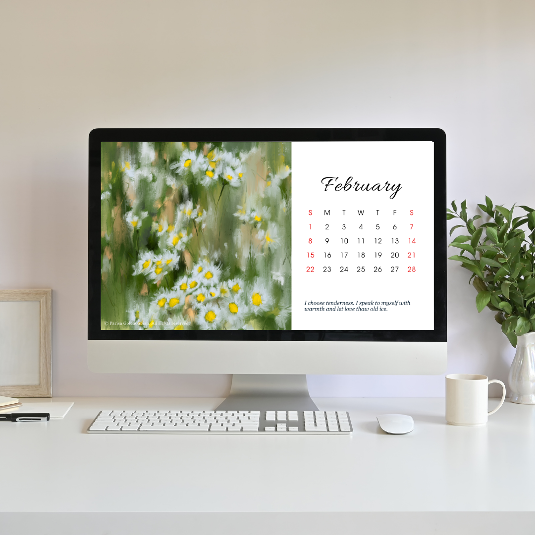 Computer monitor displaying a calendar with February on a desk setup.